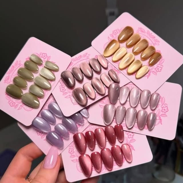 Six made-to-order cat-eye press-on nail sets on Desk to Diva cards